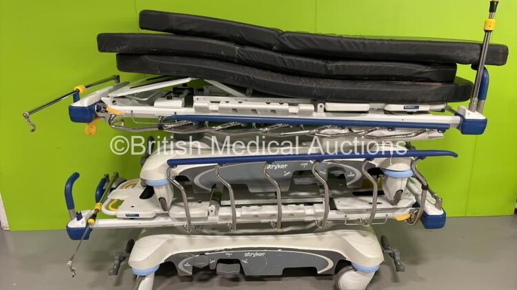 2 x Stryker 1105 5th Wheel Patient Stretchers with 3 x Mattresses (Hydraulics Tested Working - Unable to Lower Drip Stands)