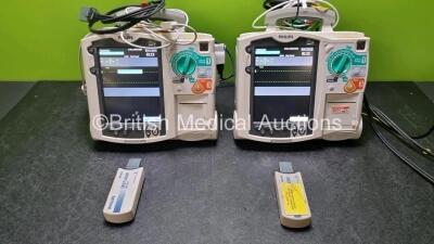 2 x Philips Heartstart MRx Defibrillators / Monitors Including Pacer, ECG and Printer Options with 2 x Paddle Leads, 2 x Philips M3725A Test Loads, 2 x 3 Lead ECG Leads and 2 x Philips M3539A Modules (Both Power Up) *SN US00550969 / US00564937*