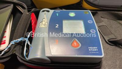 2 x Philips Heartstart FR2+ Defibrillators and 1 x Laerdal Heartstart FR2+ Defibrillator with 3 x Philips M3864A Batteries and 1 x Philips M3863A Battery (All Power Up and Pass Self Test) *SN 1205178623, 0208271057, 1206215915* - 3