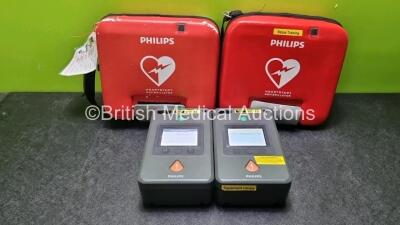 2 x Philips FR3 Heartstart Defibrillators in Carry Cases with 2 x Batteries *Install Before 10-2022 / 06-2027* (Both Power Up, 1 x Failed Self Test) *SN C14B00559 / C17A-00060*