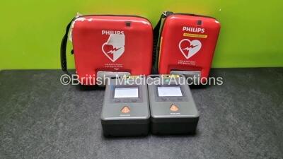 2 x Philips FR3 Heartstart Defibrillators in Carry Cases with 2 x Batteries *Install Before 06-2027 / 03-2026* (Both Power Up) *SN C148-00504 / C12F-00973*