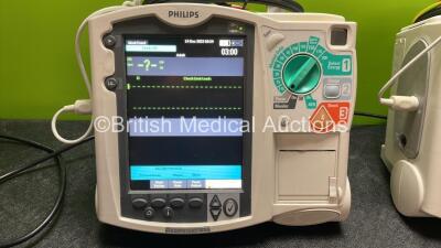 2 x Philips Heartstart MRx Defibrillators Including Pacer ,ECG and Printer Options with 2 x Paddle Leads, 2 x Philips M3725A Test Loads, 2 x 3 Lead ECG Leads, 2 x Philips M3538A Batteries and 2 x Philips M3539A Modules (Both Power Up) *SN US00564938, US00 - 2