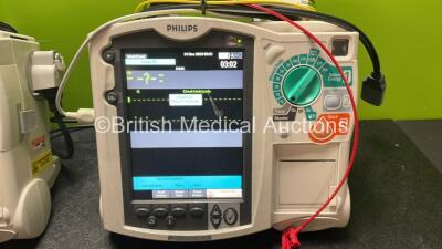 2 x Philips Heartstart MRx Defibrillators Including Pacer ,ECG and Printer Options with 2 x Paddle Leads, 2 x Philips M3725A Test Loads, 2 x 3 Lead ECG Leads, 2 x Philips M3538A Batteries and 2 x Philips M3539A Modules (Both Power Up) *SN US00564938, US00 - 3