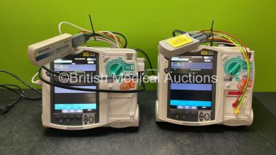 2 x Philips Heartstart MRx Defibrillators Including Pacer ,ECG and Printer Options with 2 x Paddle Leads, 2 x Philips M3725A Test Loads, 2 x 3 Lead ECG Leads, 2 x Philips M3538A Batteries, and 2 x Philips M3539A Modules (Both Power Up) *SN US00599187, US0