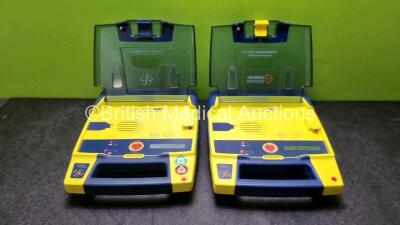 2 x Cardiac Science Powerheart AED G3 Defibrillators with 2 x Powerheart AED G3 Batteries (Both Power Up)