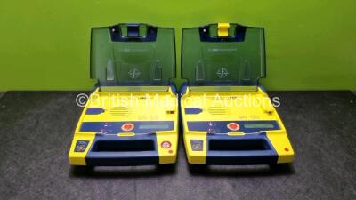 2 x Cardiac Science Powerheart AED G3 Defibrillators with 2 x Powerheart AED G3 Batteries (Both Power Up)