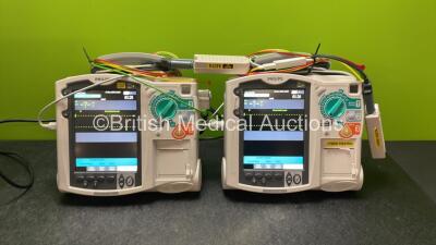 2 x Philips Heartstart MRx Defibrillators Including Pacer ,ECG and Printer Options with 2 x Paddle Leads, 2 x Philips M3725A Test Loads, 2 x 3 Lead ECG Leads, 2 x Philips M3538A Batteries, and 2 x Philips M3539A Modules (Both Power Up) *SN US00585182, US0