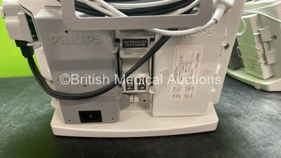 2 x Philips Heartstart MRx Defibrillators Including Pacer ,ECG and Printer Options with 2 x Paddle Leads, 2 x Philips M3725A Test Loads, 2 x 3 Lead ECG Leads, 2 x Philips M3538A Batteries, and 2 x Philips M3539A Modules (Both Power Up) *SN US00585182, US0 - 5