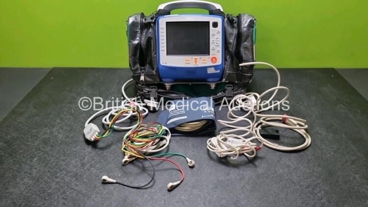 Zoll X Series Monitor/Defibrillator Including ECG, SPO2, NIBP, CO2 and Printer Options with 1 x Sure Power II Battery, 1 x NIBP Cuff and Hose, 1 x 4 Lead ECG Lead, 1 x 6 Lead ECG Lead, 1 x Paddle Lead and 1 x SPO2 Finger Sensor in Carry Bag (Powers Up and