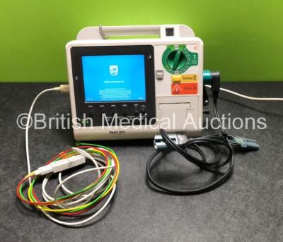 Philips Heartstart XL+ Defibrillator Including Pacer, ECG and Printer Options with 1 x Philips M1674A 3 Lead ECG Lead, 1 x Philips Battery Ref 989803167281 and 1 x Paddle Lead (Powers Up)