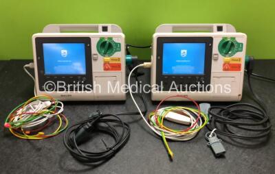 2 x Philips Heartstart XL+ Defibrillators Including ECG and Printer Options with 2 x Philips M1674A 3 Lead ECG Leads, 2 x Philips Batteries Ref 989803167281 and 2 x Paddle Leads (Both Power Up)