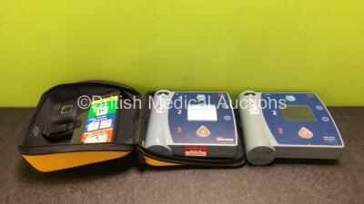 Job Lot Including 1 x Laerdal Heartstart FR2 Defibrillator with 1 x Battery in Case and 1 x Philips Heartstart FR2+ Defibrillator with 1 x Battery (Both Power Up, 1 x Flat Battery and 1 x Low Battery)