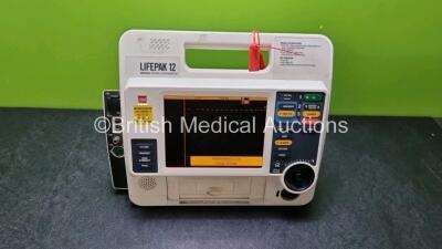 Medtronic Lifepak 12 Physio Control Defibrillator / Monitor Including ECG, NIBP, SpO2, CO2 and Printer Options (Power Up with Stock Battery, Stock Battery Not Included, Service Light On, Service Light on)