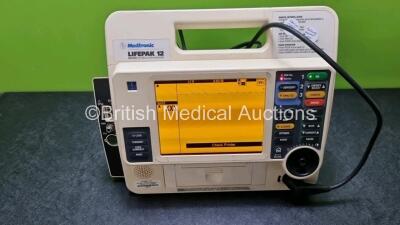 Medtronic Lifepak 12 Physio Control Defibrillator / Monitor Including, Pacer, ECG, NIBP, SpO2, and Printer Options (Power Up with Stock Battery, Stock Battery Not Included, Service Light On)