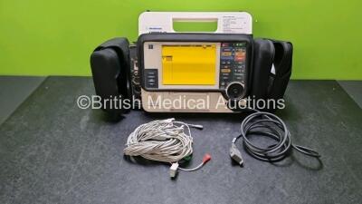 Medtronic Lifepak 12 Physio Control Defibrillator / Monitor Including Pacer, ECG, NIBP, SpO2, P1, P2 and Printer Options, 2 x ECG Leads (Power Up with Stock Battery, Stock Battery Not Included , Service Light on)