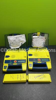 2 x Powerheart AED G3 AutoMated External Defibrillators with 4 x Batteries (Both Power Up)