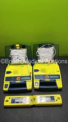 2 x Powerheart AED G3 AutoMated External Defibrillators with 4 x Batteries (Both Power Up)