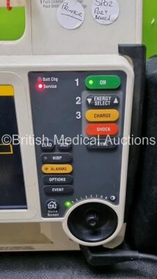 Medtronic Lifepak 12 Physio Control Defibrillator / Monitor Including ECG, SpO2 and Printer Options , 1 x Paddle Lead (Power Up with Stock Battery, Stock Battery Not Included, Damage to Casing and Printer Missing - See Photos, Service Light On) - 4