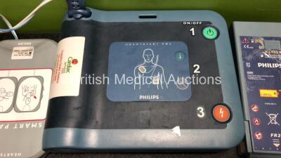 Job Lot Including 1 x Philips Heartstart FRx Defibrillator (Powers Up) with 1 x Battery and 1 x Smart Pads II Pack *Expired* and 1 x Philips M3863A Battery (Untested) - 2