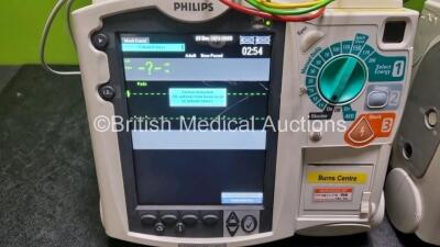 2 x Philips Heartstart MRx Defibrillators / Monitors Including ECG and Printer Options with 2 x Paddle Leads, 2 x Philips M3725A Test Loads, 2 x 3 Lead ECG Leads and 2 x Philips M3539A Modules (Both Power Up) *SN US00576155 / US00576154* - 2