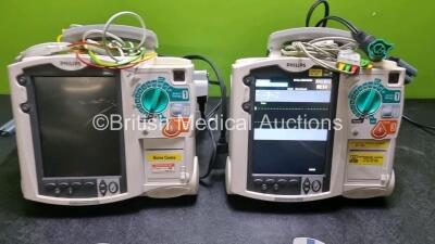 2 x Philips Heartstart MRx Defibrillators / Monitors Including ECG and Printer Options with 2 x Paddle Leads, 2 x Philips M3725A Test Loads, 2 x 3 Lead ECG Leads and 2 x Philips M3539A Modules (Both Power Up) *SN US00576155 / US00576154* - 3