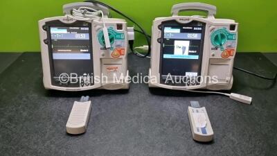 2 x Philips Heartstart MRx Defibrillators / Monitors Including ECG and Printer Options with 2 x Paddle Leads, 2 x Philips M3725A Test Loads, 2 x ECG Lead Connectors and 2 x Philips M3539A Modules (Both Power Up) *SN US00568922 / US0068919*