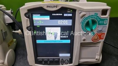 2 x Philips Heartstart MRx Defibrillators / Monitors Including ECG and Printer Options with 2 x Paddle Leads, 2 x Philips M3725A Test Loads, 2 x ECG Lead Connectors and 2 x Philips M3539A Modules (Both Power Up) *SN US00568922 / US0068919* - 2