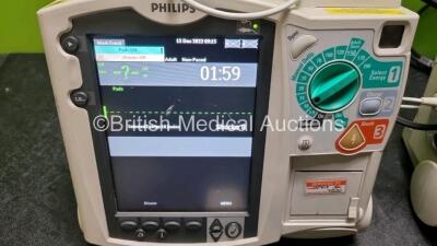 2 x Philips Heartstart MRx Defibrillators / Monitors Including ECG and Printer Options with 2 x Paddle Leads, 2 x Philips M3725A Test Loads, 2 x ECG Lead Connectors and 2 x Philips M3539A Modules (Both Power Up) *SN US00568922 / US0068919* - 3