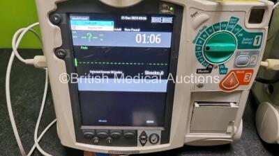 2 x Philips Heartstart MRx Defibrillators / Monitors Including ECG and Printer Options with 2 x Paddle Leads, 2 x Philips M3725A Test Loads, 2 x ECG Lead Connectors and 2 x Philips M3539A Modules (Both Power Up) *SN US00584968 / US00581612* - 2