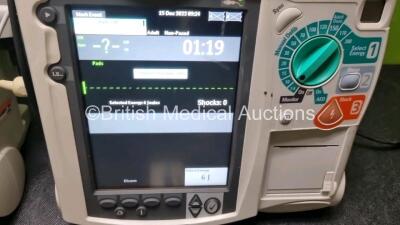 2 x Philips Heartstart MRx Defibrillators / Monitors Including ECG and Printer Options with 2 x Paddle Leads, 2 x Philips M3725A Test Loads, 2 x ECG Lead Connectors and 2 x Philips M3539A Modules (Both Power Up) *SN US00584968 / US00581612* - 3