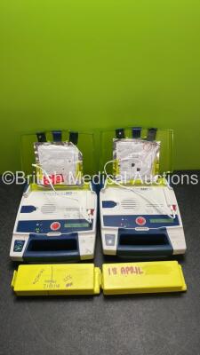 2 x Powerheart AED G3 AutoMated External Defibrillators with 4 x Batteries (Both Power Up with Faulty Display)