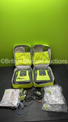 2 x Zoll AED PRO Defibrillators in Cases with 2 x Batteries, 2 x 3 Lead ECG Leads 6 x Electrode Packs (Both Power Up)