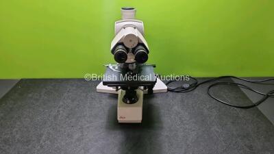 Leica DMLB Type 020-519.508L Benchtop Microscope with 2 x HC Plan s 10 x / 22 Eyepieces, 5 x Leica Optics Including 1 x PL Fluotar 2.5 x / 0.07, 1 x HCX PL S-APO 5 x / 0.14, 1 x HCX PL S-APO 10 x 0.30, 1 x HCX PL S-APO 20 x / 0.560, 1 x HCX PL S-APO 40 