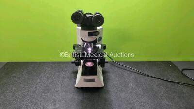 Olympus CX41 Bench Microscope with 2 x Olympus CWH 10 x - H / 20 Eyepieces and 4 x Olympus Optics Including 1 x Plan C 4 x / 0.10, 1 x Plan C 10 x / 0.25, 1 x Plan 20 x / 0.40 0.17, 1 x Plan CN 40 x 0.65 / 0.17 / FN 22 (Powers Up with Good Bulb)