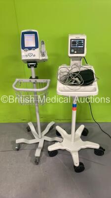 1 x Philips SureSigns VSi Patient Monitor on Stand and 1 x Welch Allyn SPOT VItal Signs Monitor on Stand (Both Power Up)