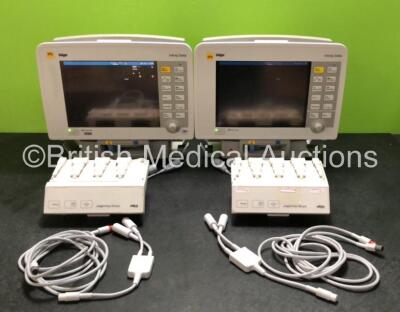 2 x Drager Infinity Delta Patient Monitors Including HemoMed 1, Aux/Hemo 3, MultiMed and NIBP Options (Both Power Up with Damage to Casing - See Photos) with 2 x Drager HemoMed Pods (Both with Damage to Casing) 2 x Drager Infinity Docking Stations,(Both w