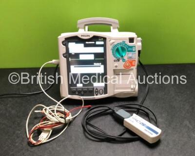 Philips Heartstart MRx Defibrillator Including ECG and Printer Options with 1 x 3 Lead ECG Lead, 1 x Paddle Lead, 1 x Philips M3725A Test Load, 1 x Philips M3538A Battery and 1 x Philips M3539A Battery Module (Powers Up)