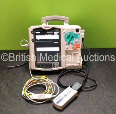 Philips Heartstart MRx Defibrillator Including ECG and Printer Options with 1 x 3 Lead ECG Lead, 1 x Paddle Lead, 1 x Philips M3725A Test Load, 1 x Philips M3538A Battery and 1 x Philips M3539A Battery Module (Powers Up)