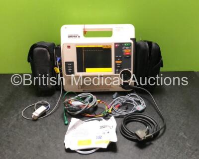 Medtronic Lifepak 12 Physio Control Defibrillator / Monitor Including ECG, SpO2 and NIBP and Printer Options (Printer Module Missing) with 2 x Batteries, 1 x 4 Lead ECG Lead, 1 x 6 Lead ECG Lead, 1 x Paddle Lead and 1 x Skintact Electrodes Pack *Expired* 