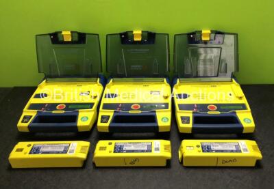 3 x Cardiac Science Powerheart AED G3 Defibrillators with 6 x Batteries (All Power Up - 3 x in Photo, 3 x in Defibrillators)