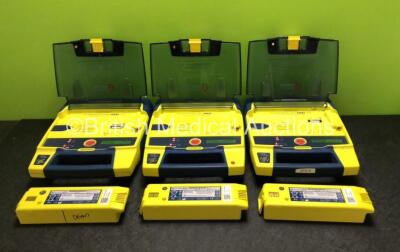 3 x Cardiac Science Powerheart AED G3 Defibrillators with 6 x Batteries (All Power Up - 3 x in Photo, 3 x in Defibrillators)