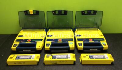 3 x Cardiac Science Powerheart AED G3 Defibrillators with 6 x Batteries (All Power Up - 3 x in Photo, 3 x in Defibrillators)