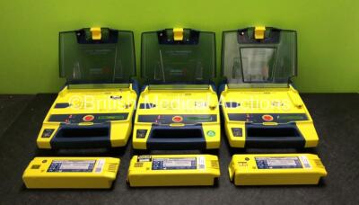 3 x Cardiac Science Powerheart AED G3 Defibrillators with 6 x Batteries (All Power Up - 3 x in Photo, 3 x in Defibrillators)