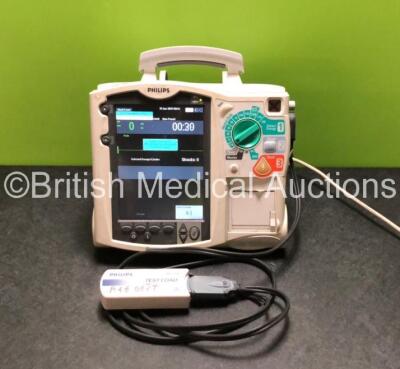 Philips Heartstart MRx Defibrillator / Monitor Including Pacer, ECG, and Printer Options with 1 x M3725A Test Load,1 x Paddle Lead and 1 x Philips M3538A Battery (Powers Up with Stock Battery Pack, 1 x Battery Included, Slight Damage to Casing - See Photo