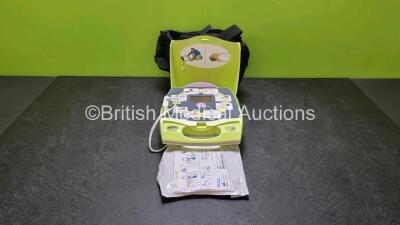 Zoll AED Plus Defibrillator In Carry Case (Powers Up) with 1 x in Date Electrode Packs