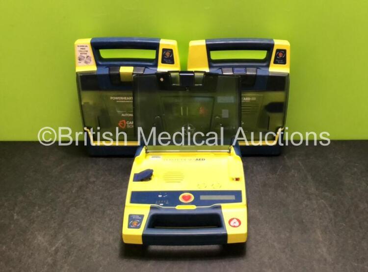 3 x Cardiac Science Powerheart AED G3 Defibrillators (All Power Up with Stock Battery, Batteries Not Included, 1 x Faulty Screen - See Photos)