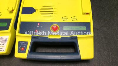 3 x Cardiac Science Powerheart AED G3 Defibrillators (All Power Up with Stock Battery, Batteries Not Included, 1 x Faulty Screen - See Photos) - 6