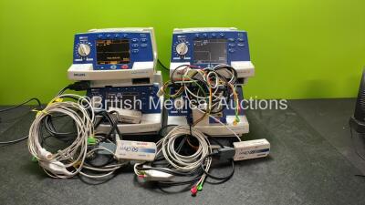 4 x Philips Heartstart XL Defibrillators Including ECG and Printer Options with 4 x Paddle Leads, 4 x Philips M3725A Test Loads and 4 x 3 Lead ECG Leads (All Power Up) *SN US00601964, US00116956, US00601961, US00116953*