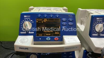 4 x Philips Heartstart XL Defibrillators Including ECG and Printer Options with 4 x Paddle Leads, 4 x Philips M3725A Test Loads and 4 x 3 Lead ECG Leads (All Power Up) *SN US00601964, US00116956, US00601961, US00116953* - 2