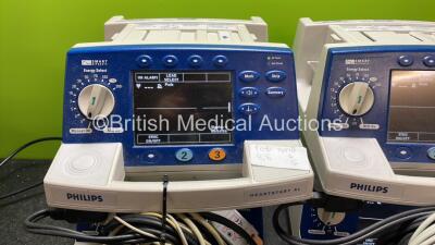 4 x Philips Heartstart XL Defibrillators Including ECG and Printer Options with 4 x Paddle Leads, 4 x Philips M3725A Test Loads and 4 x 3 Lead ECG Leads (All Power Up) *SN US00458261, US00468747, US00578464, US00595806* - 2